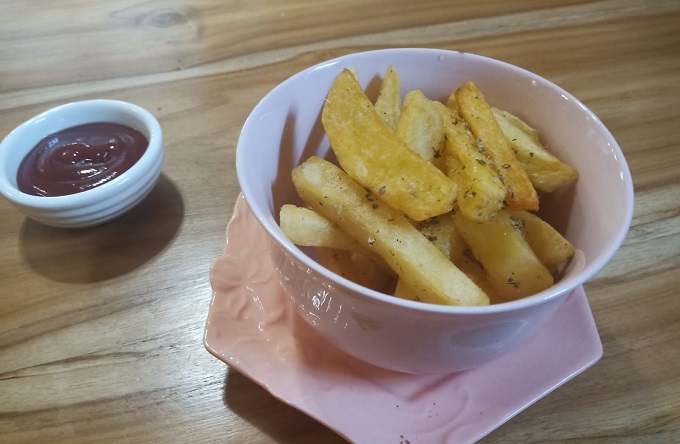 bowl of french fries with dip